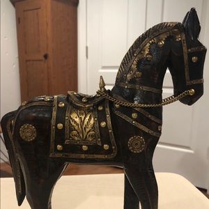 Carved wooden horse with gold detail